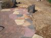 pavers-with-flagstone-edging-and-inset-boulder